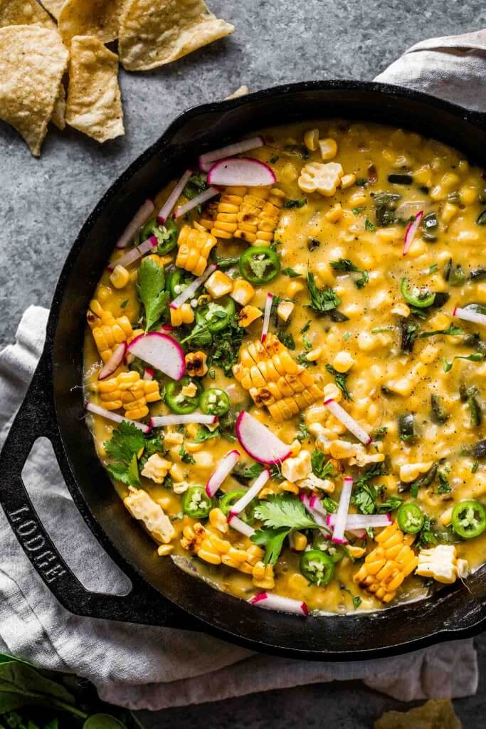 Overhead shot of corn queso dip in skillet.