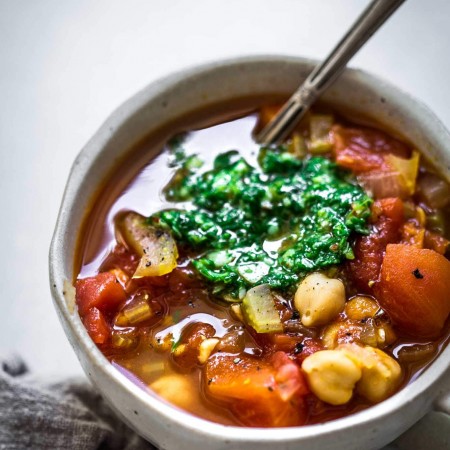 Side view of bowl of Instant Pot Bean Soup with Pesto