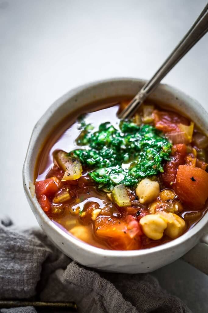 Side view of bowl of Instant Pot Bean Soup with Pesto