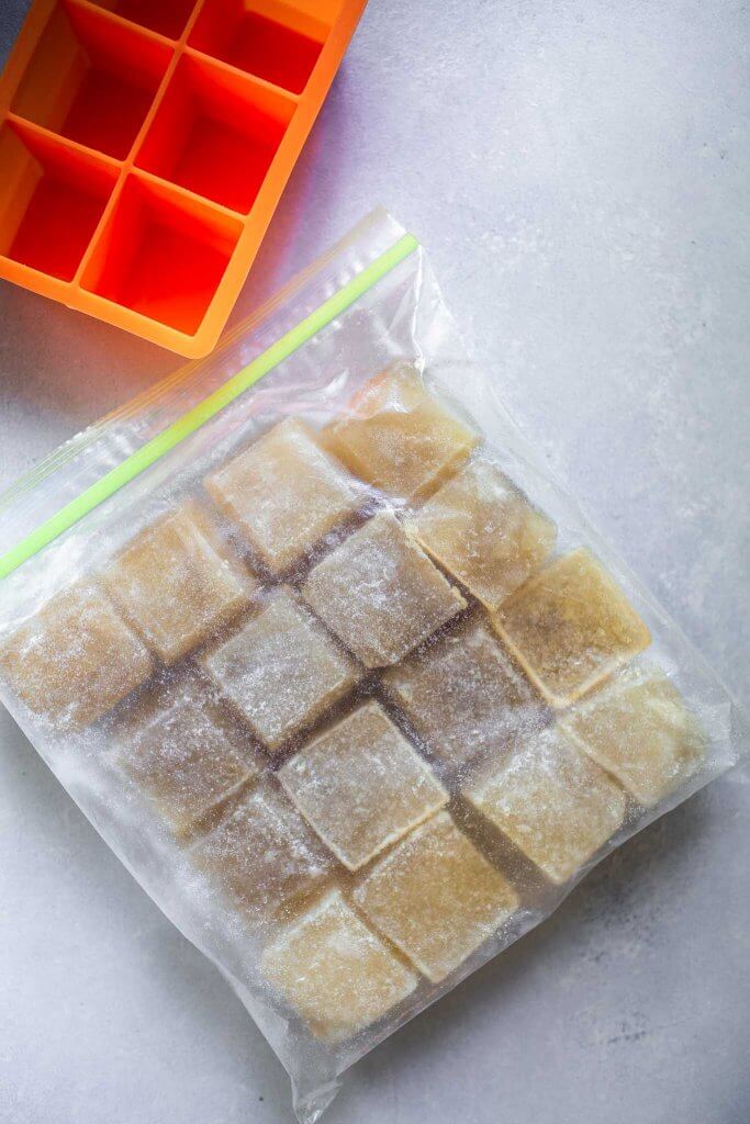 Cubes of frozen bone broth in large baggie. 