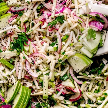 Close up of apple slaw in serving bowl.