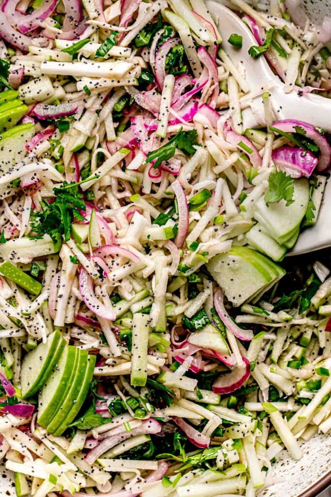 Close up of apple slaw in serving bowl.