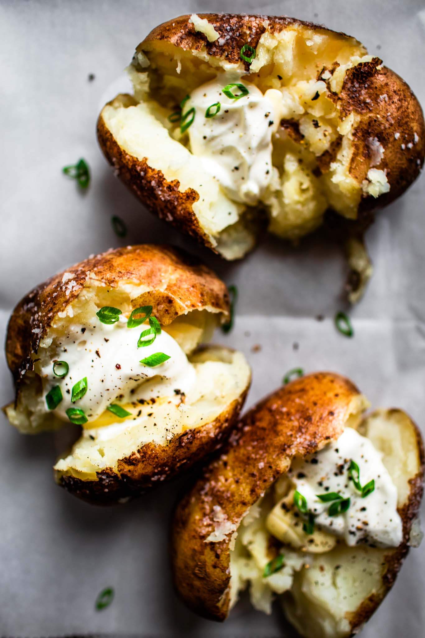 Overhead close up of baked potatoes.