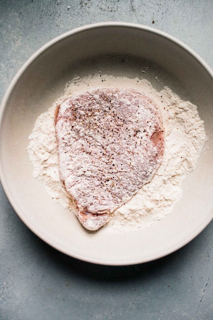 Pork cutlet dredged in flour. 