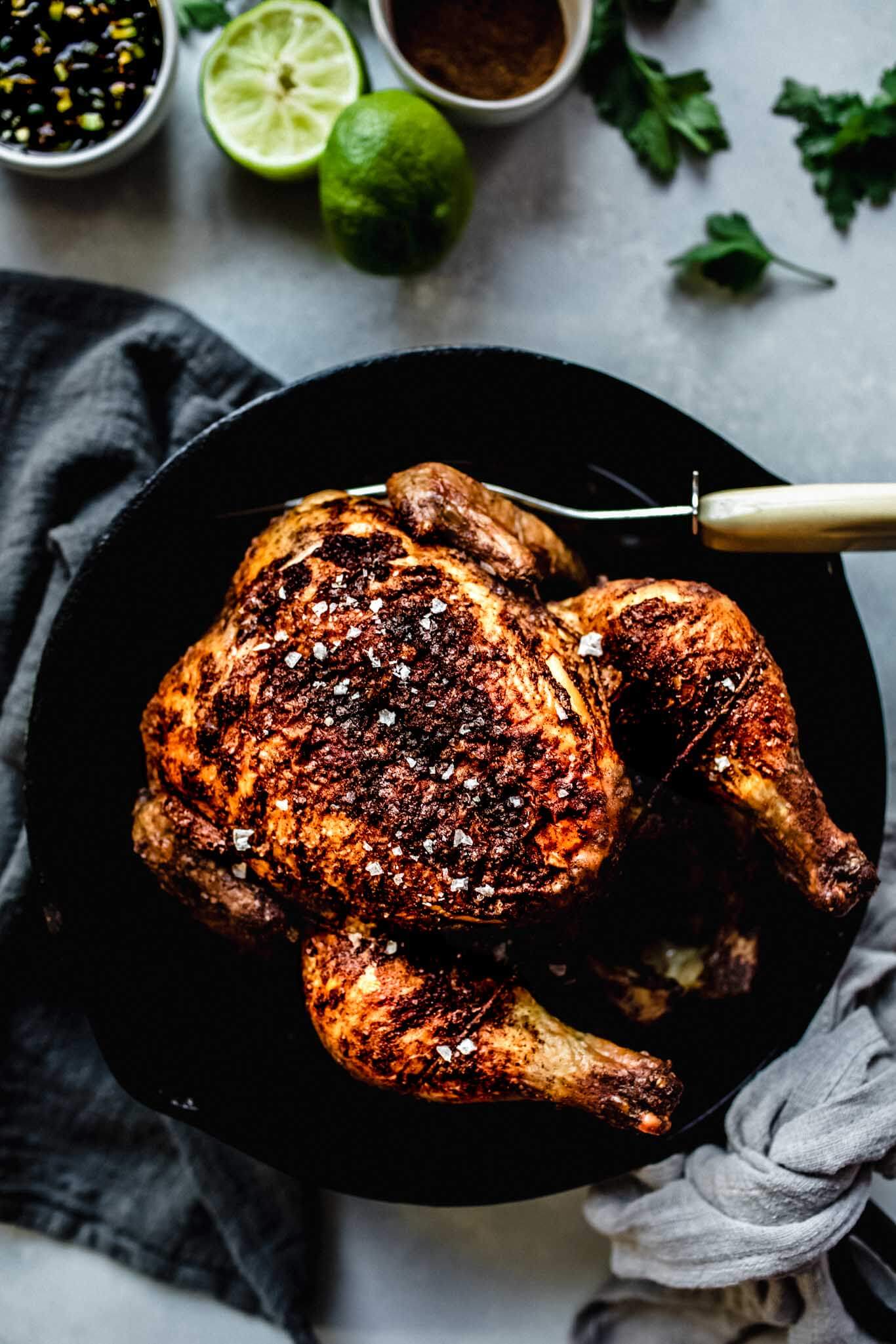 Overhead shot of chicken in cast iron skillet.