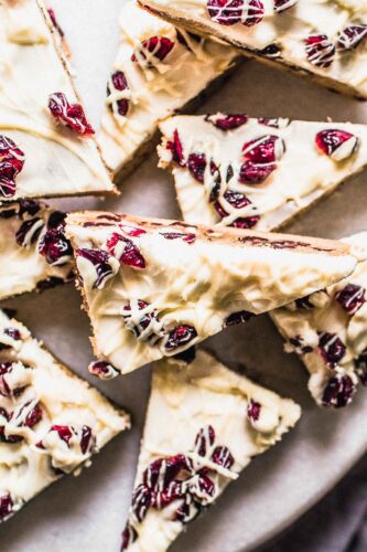 Close up of cranberry bliss bars on serving tray.