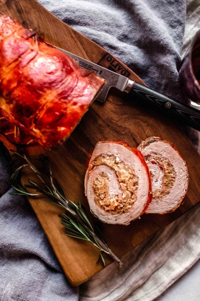 Overhead shot of sliced stuffed pork loin.