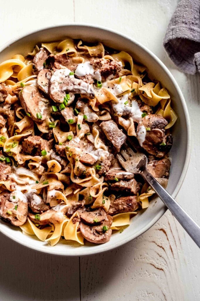 Stroganoff in white serving bowl. 