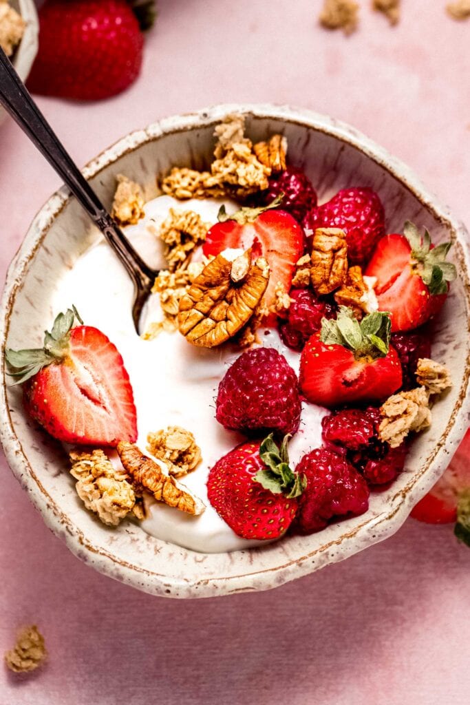 Yogurt parfait with strawberries, raspberries and granola.