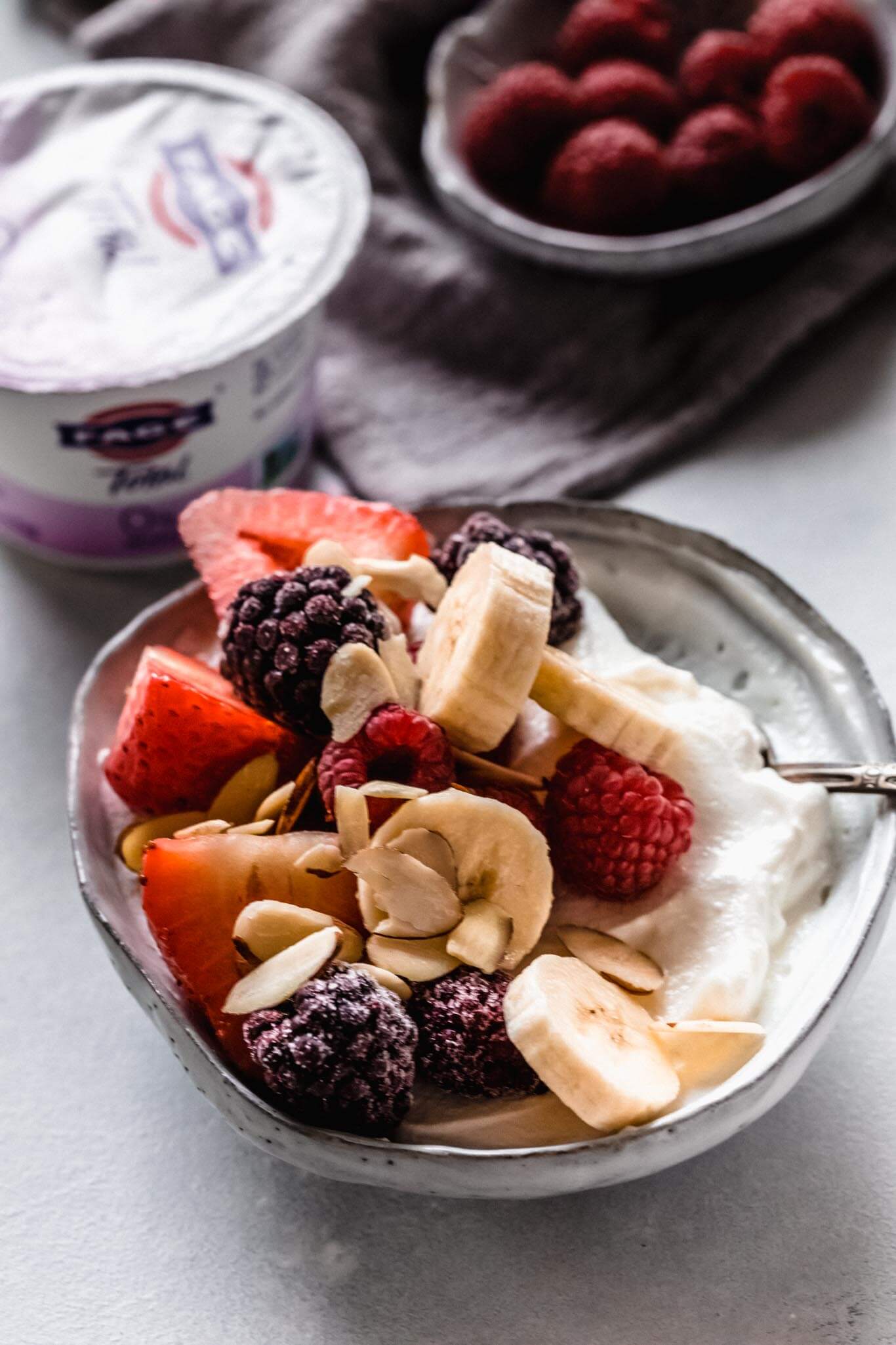 Yogurt topped with berries & banana.
