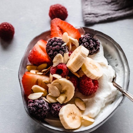 Yogurt topped with berries & banana.