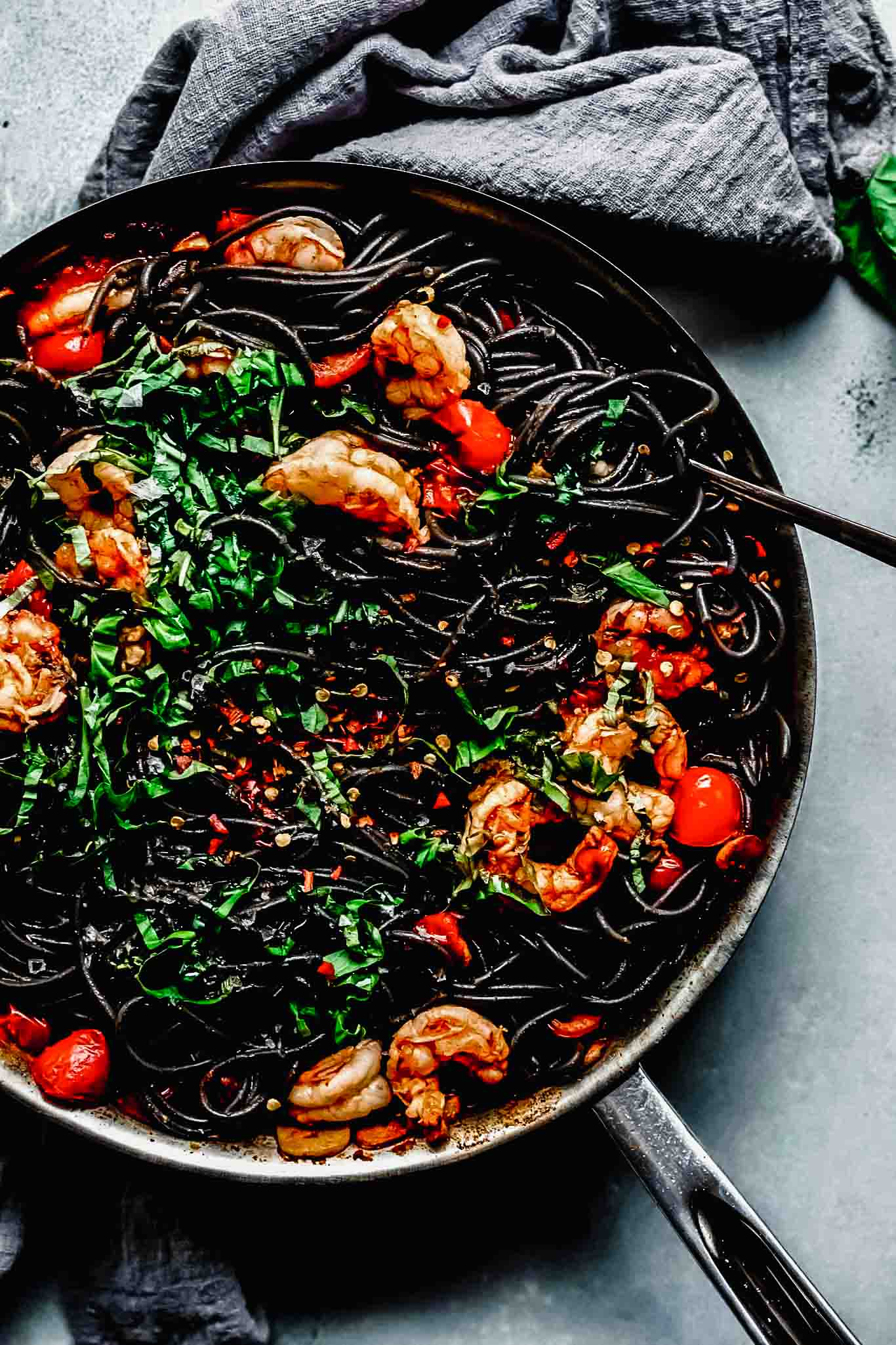 Squid ink pasta in skillet. 