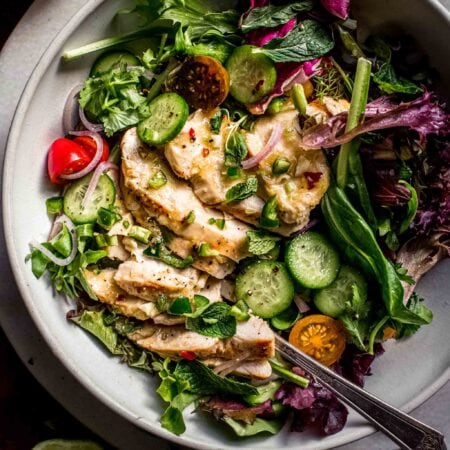 Overhead shot of Thai Chicken Salad in white bowl.