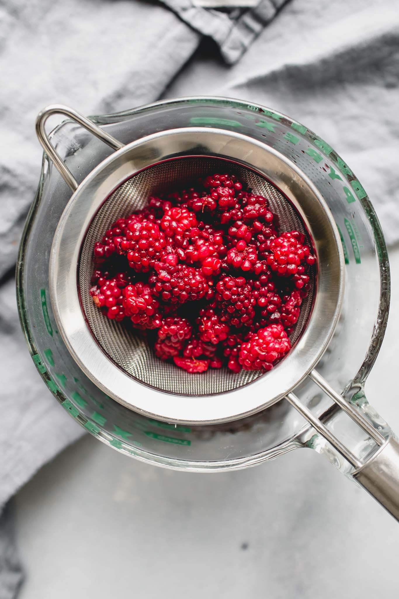 Blackberries in strainer.