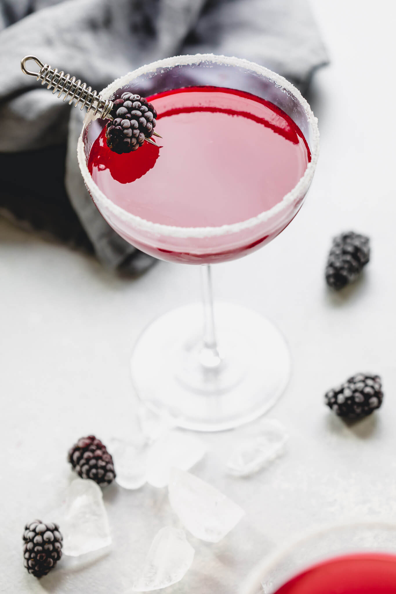 Two blackberry lemon drop cocktails.