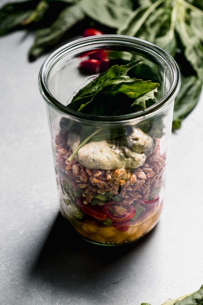 Farro salad in large mason jar.
