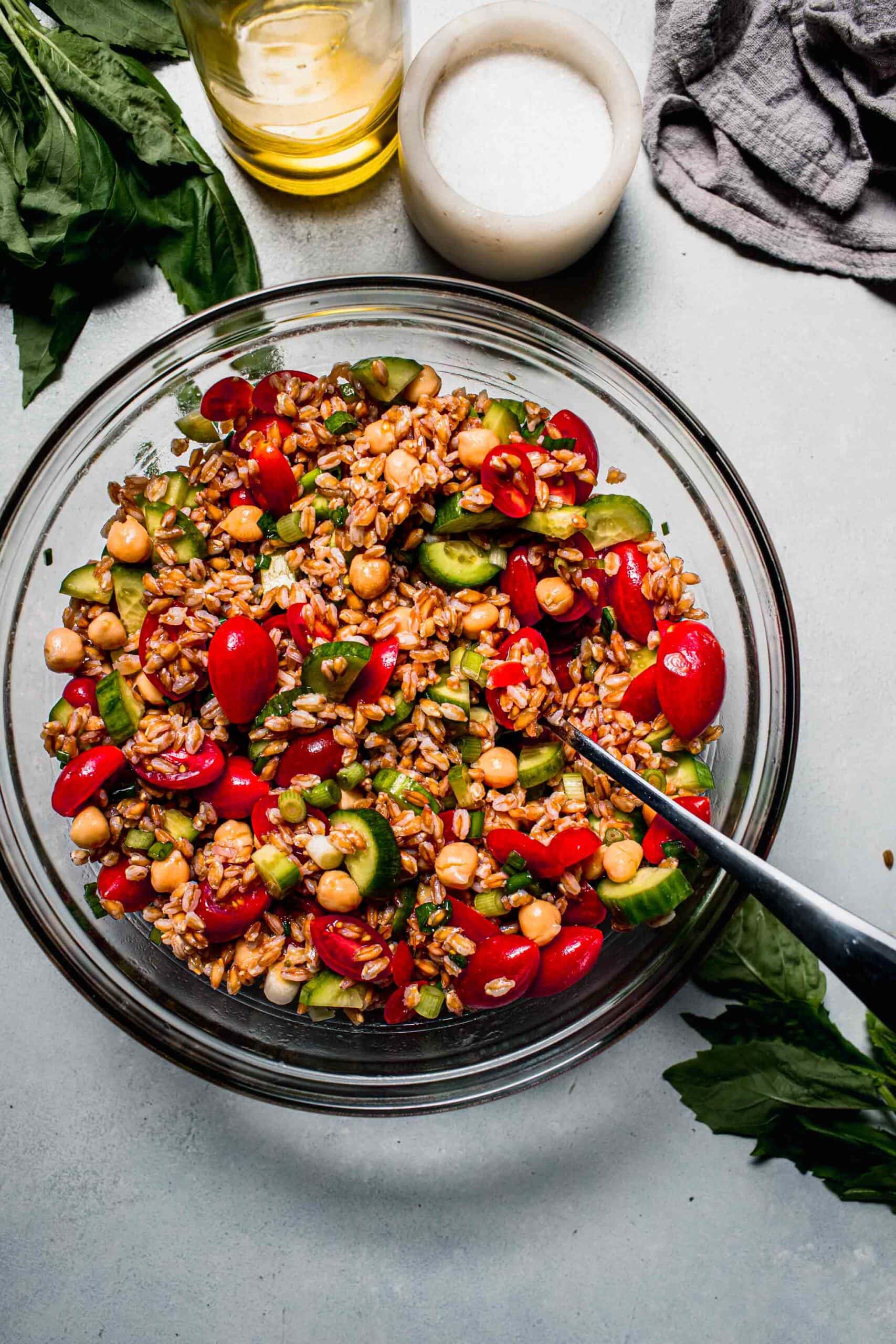 Farro salad ingredients in bowl before tossing. 