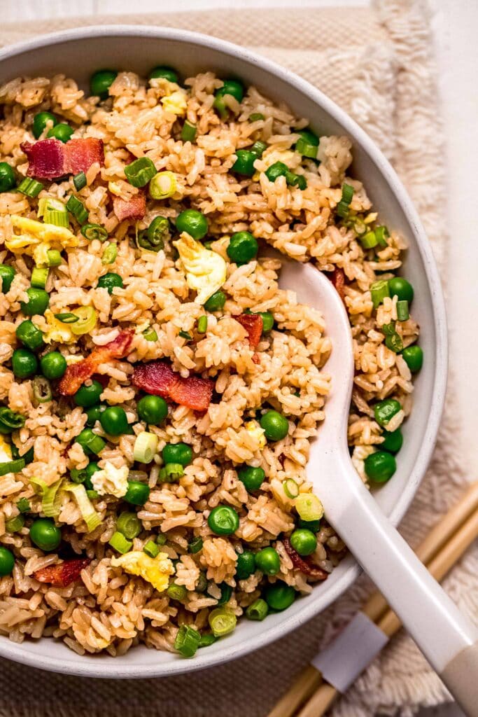 Instant pot fried rice in serving bowl with spoon.