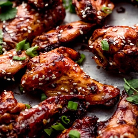 Side view of glazed wings on sheet of parchment.