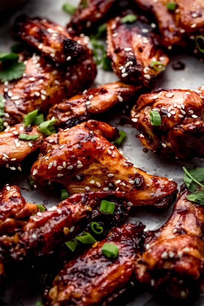 Side view of glazed wings on sheet of parchment.