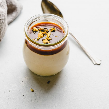 One jar of butterscotch budino topped with salted caramel.