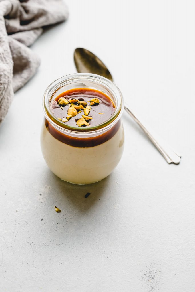 One jar of butterscotch budino topped with salted caramel.