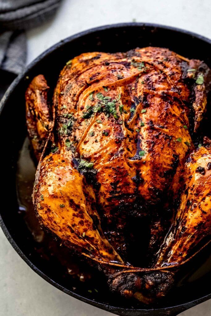 Roasted chicken in cast iron skillet.