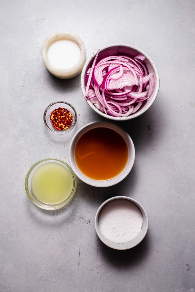 Ingredients for pickled onions on counter. 