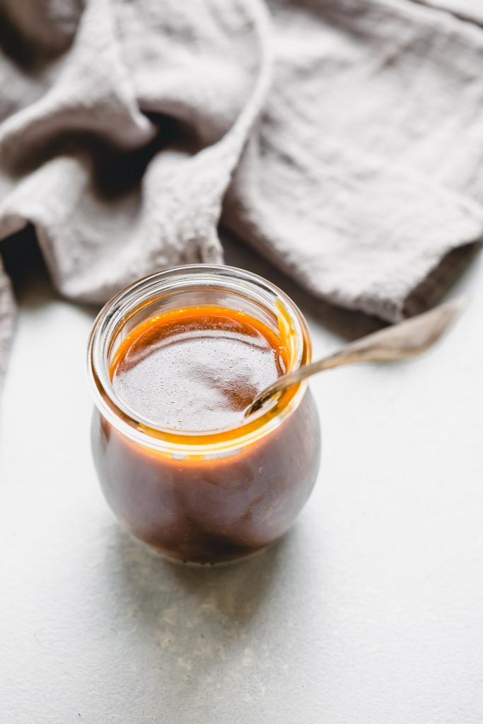 Salted caramel sauce in small weck jar.