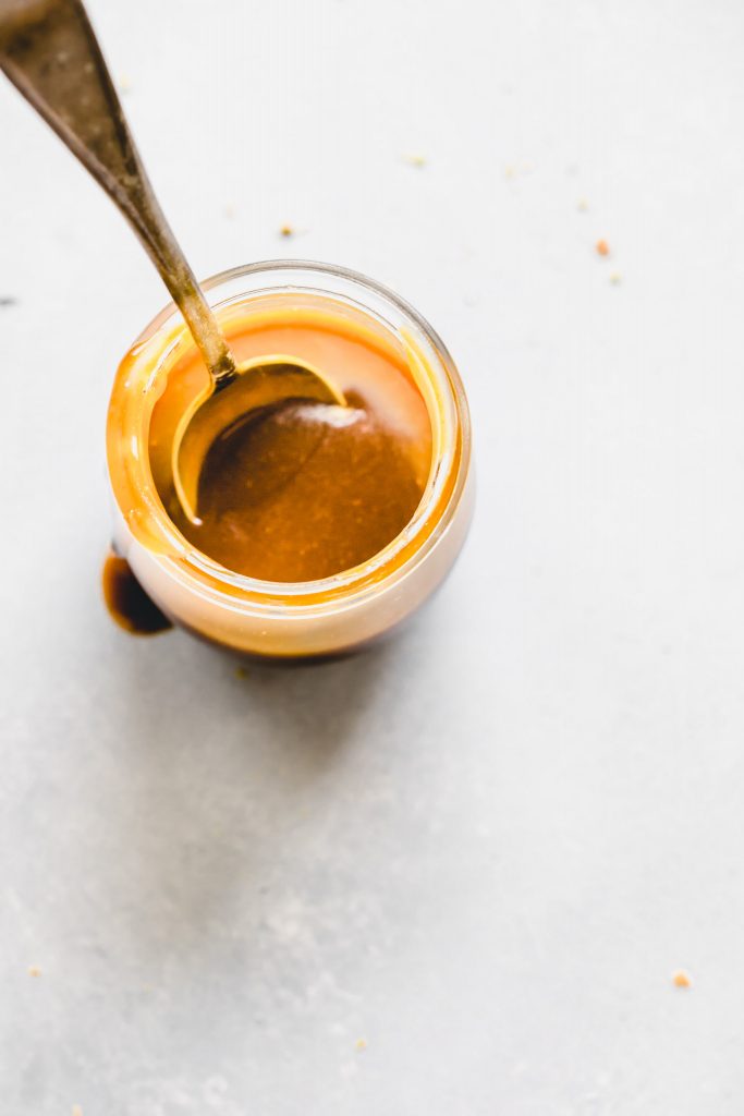Salted caramel sauce in small bowl. 