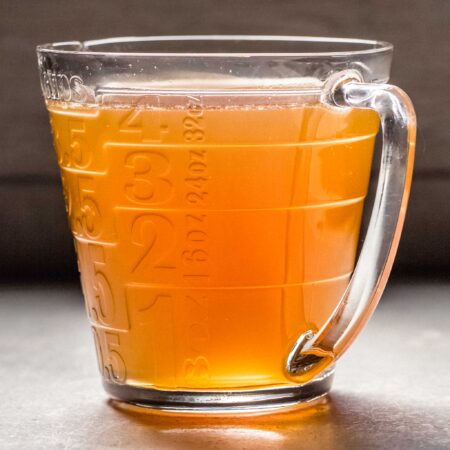 Bone broth in large measuring cup.