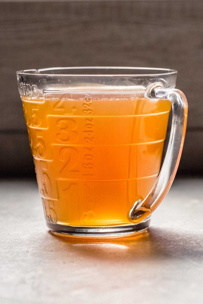 Bone broth in large measuring cup.