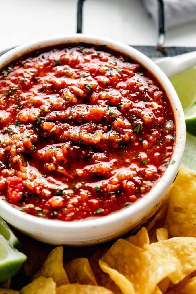 Side view of chipotle salsa in white bowl. 