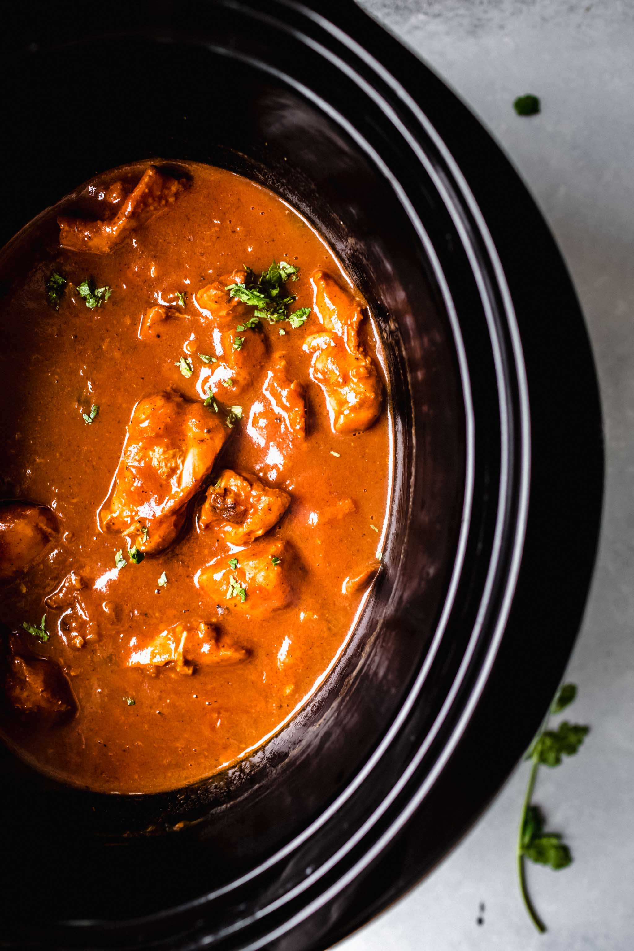 Butter chicken in slow cooker after cooking for 3 hours. 