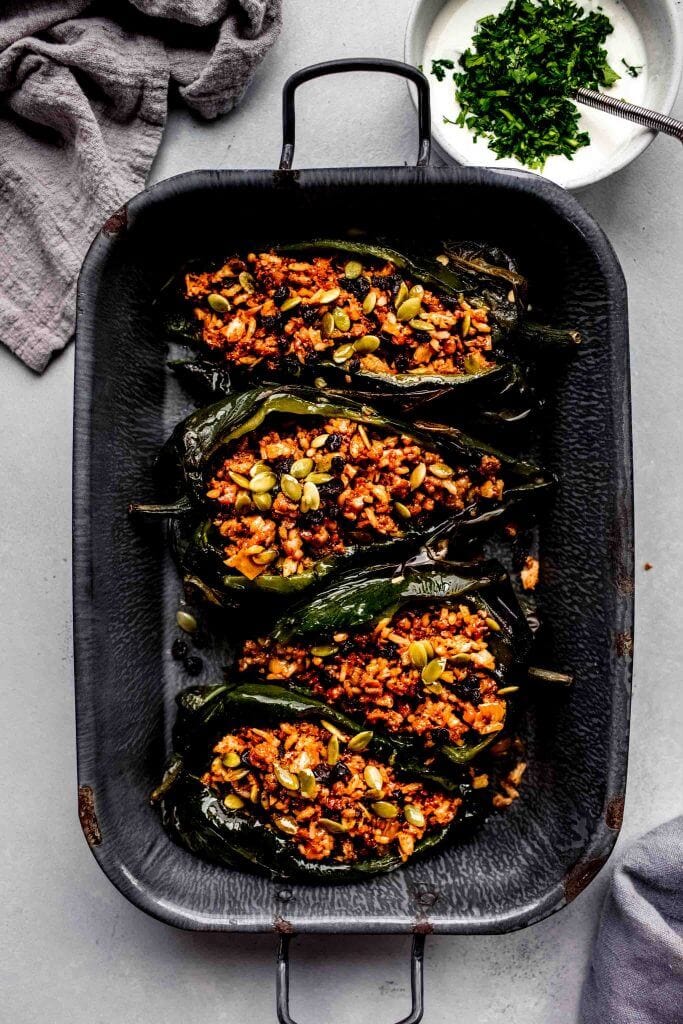 Stuffed poblano peppers in baking dish. 