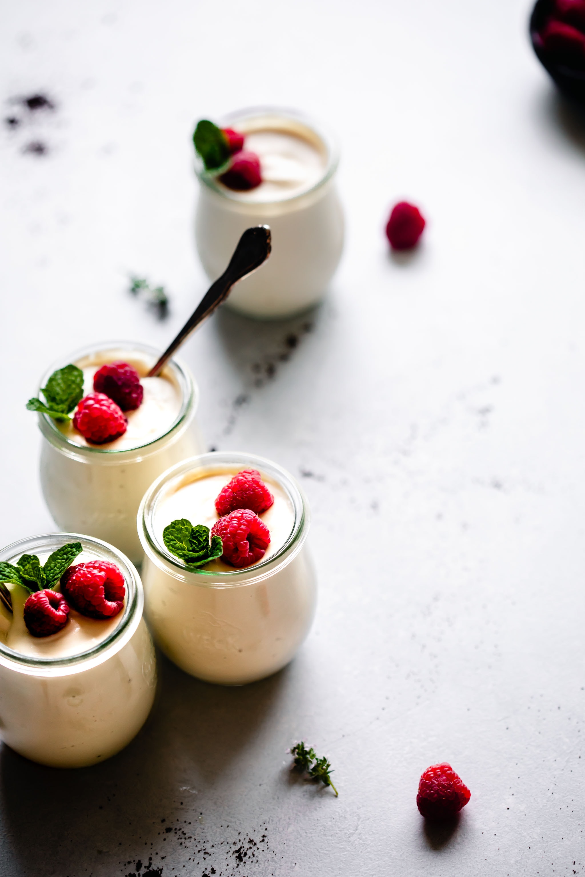 Side view of jars of ricotta mousse.