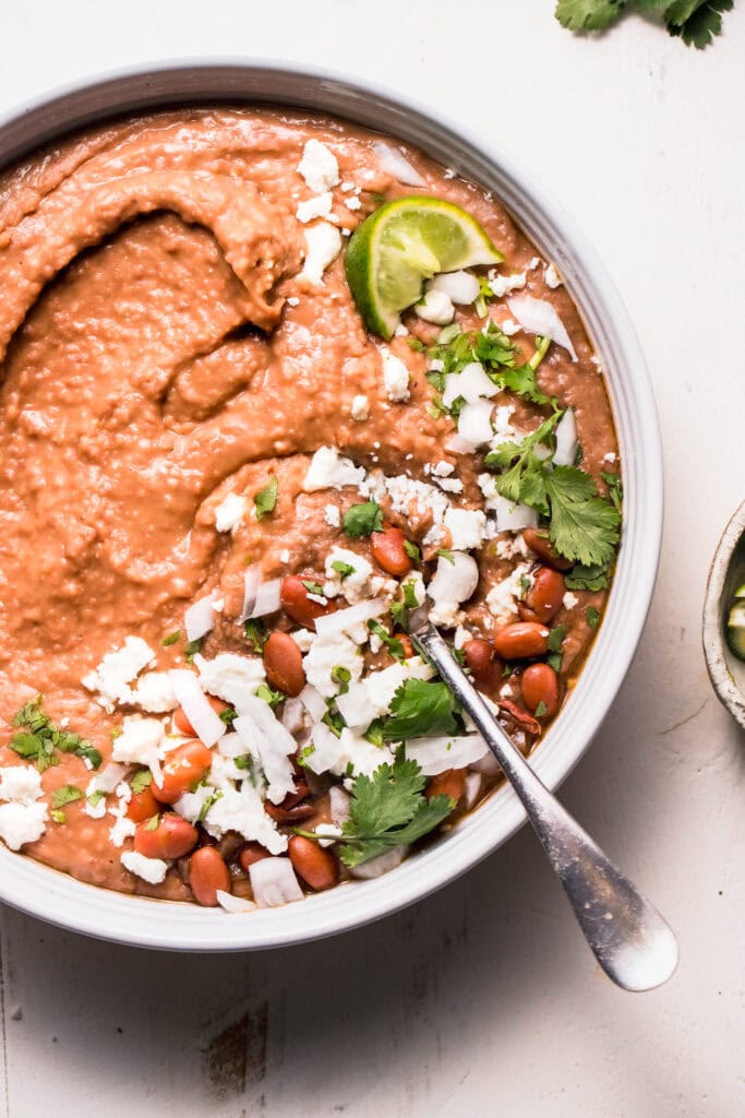 Overhead close up of instant pot refried beans ready to serve.