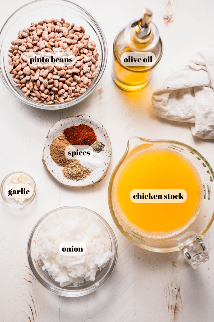 Ingredients for instant pot refried beans labeled on counter. 