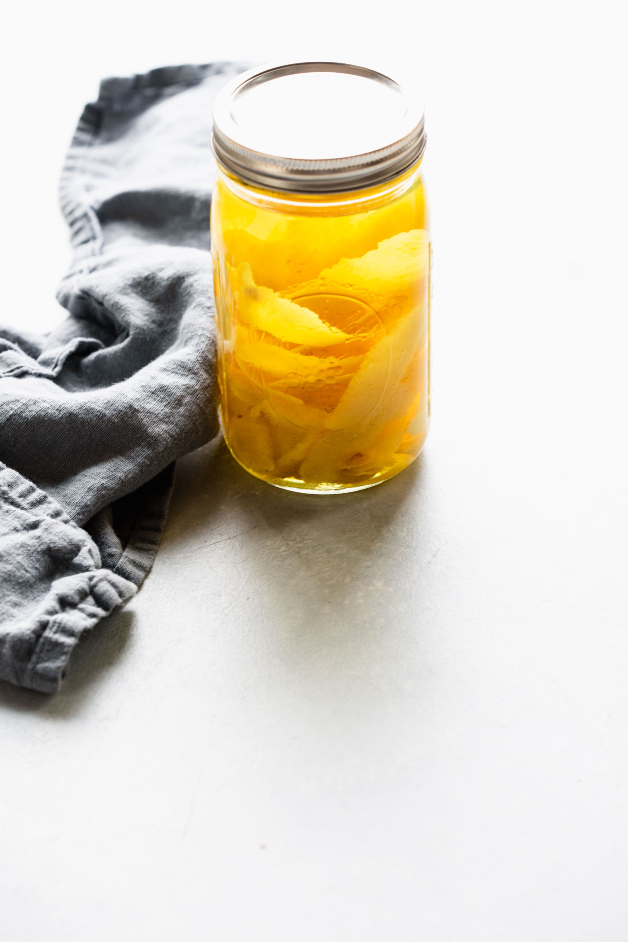 Jar of vodka and lemon peels after cooking sous vide.