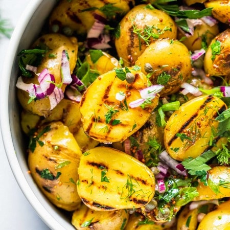 Overhead close up of bowl of grilled potato salad.