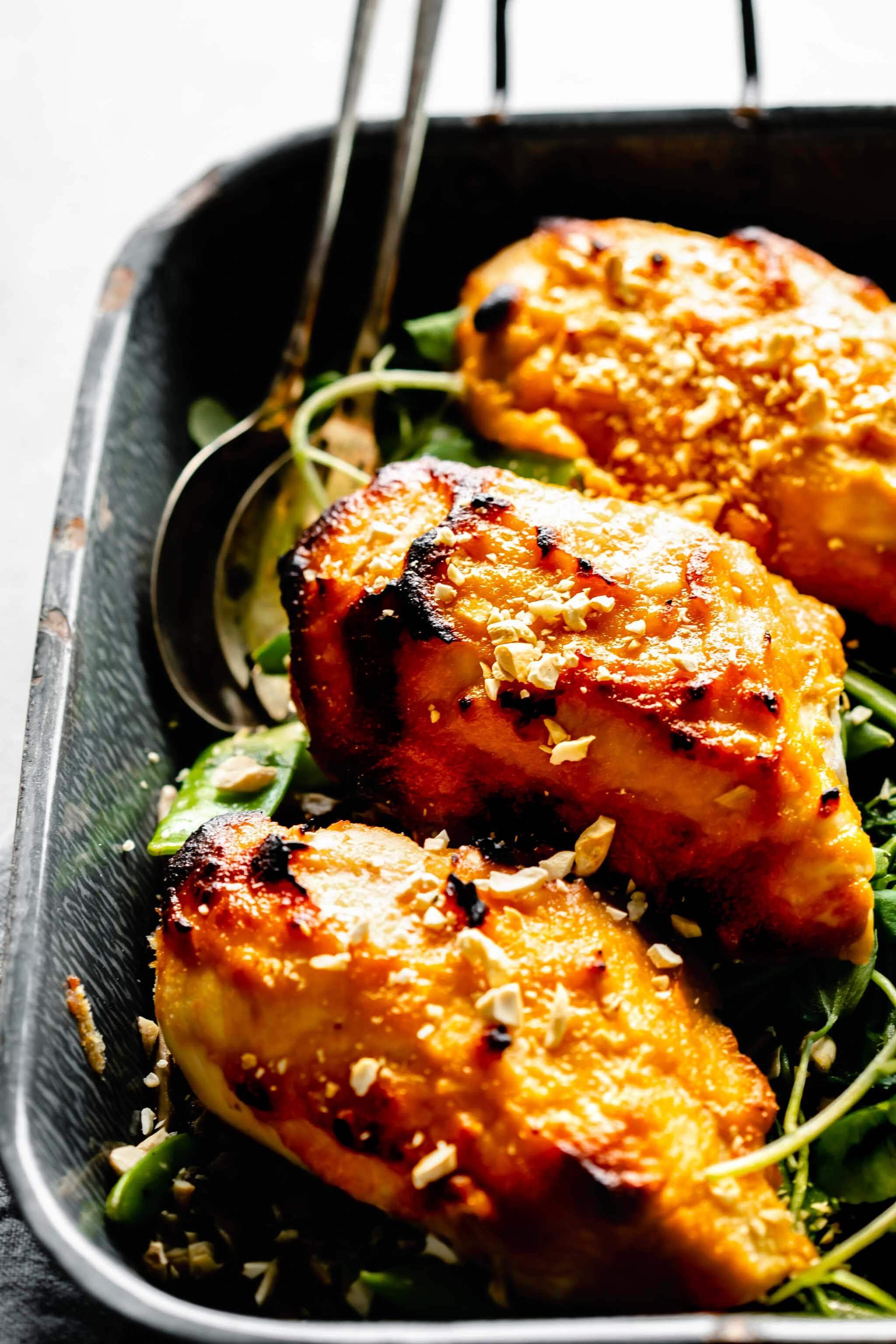 Side view of miso glazed chicken on serving platter.