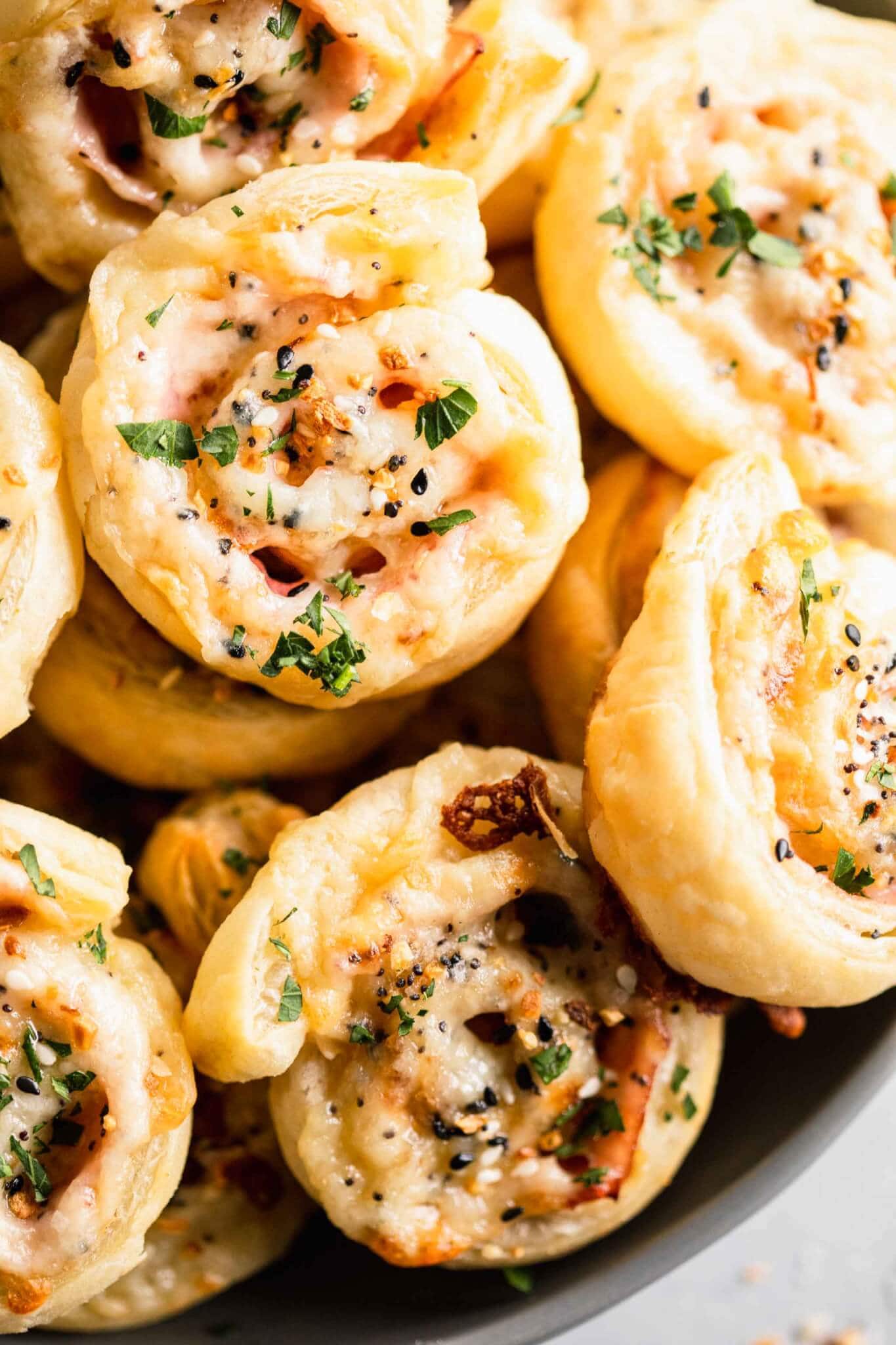 Ham & Cheese pinwheels arranged on grey serving dish.