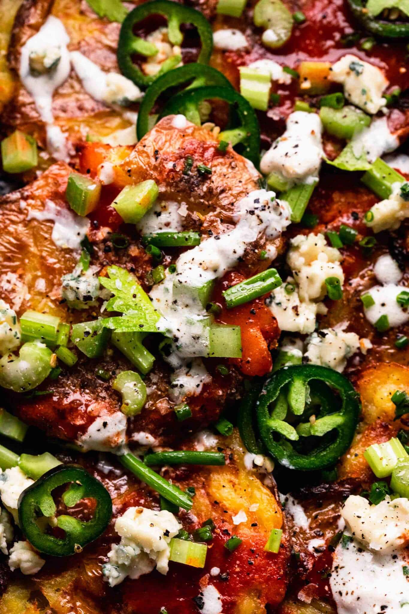 Overhead close up of smashed potatoes with all toppings.