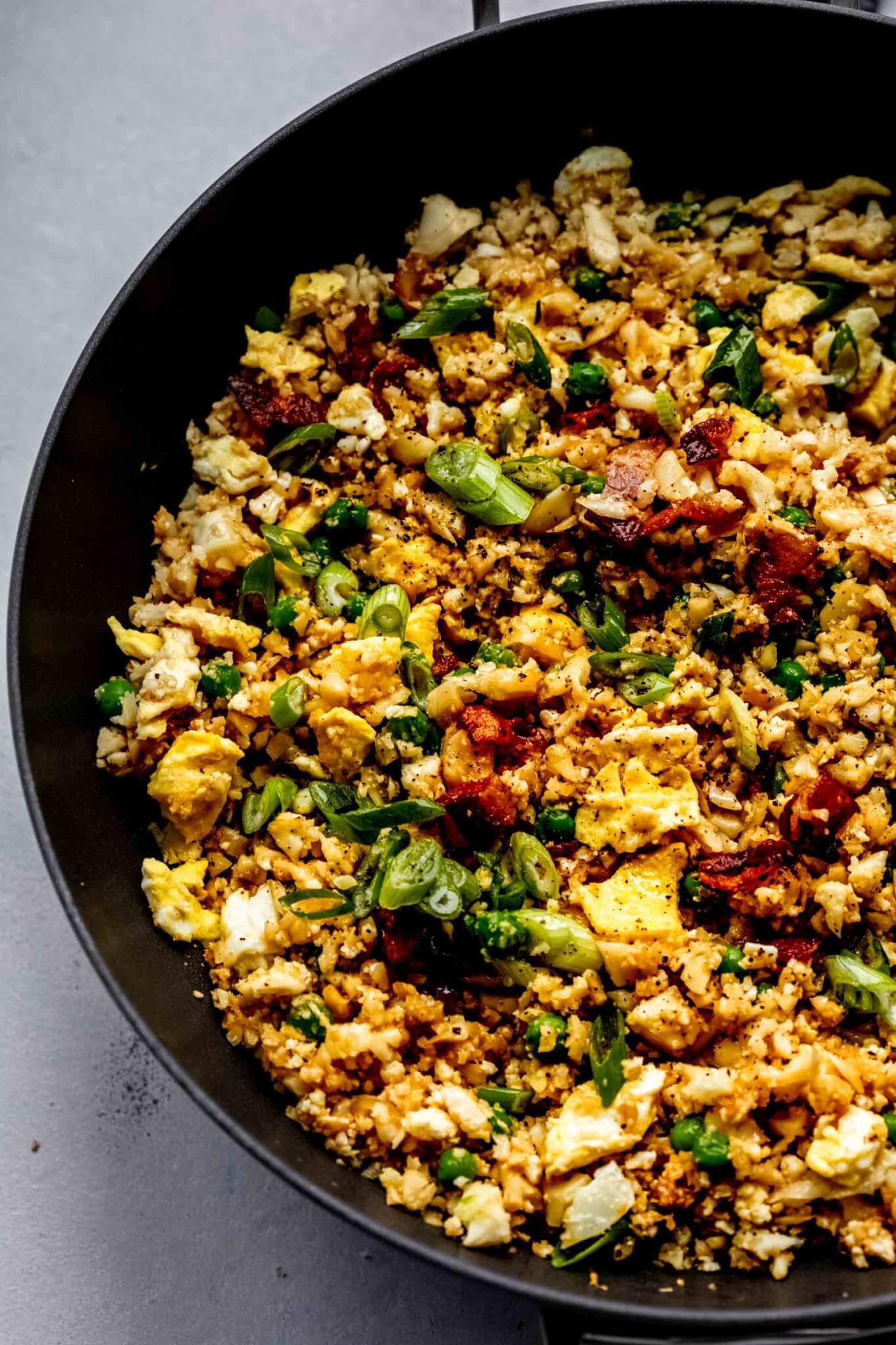 Cauliflower fried rice in wok after cooking.