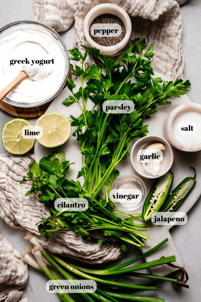 Ingredients for green goddess dressing labeled on counter.