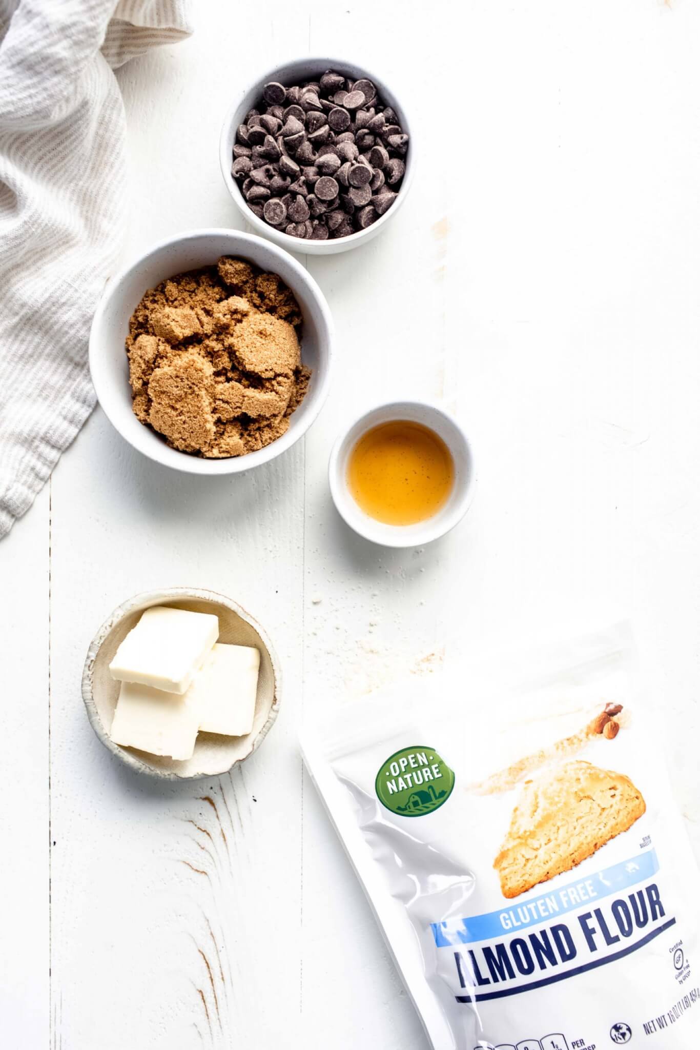 Ingredients for cookie dough bites laid out on white countertop