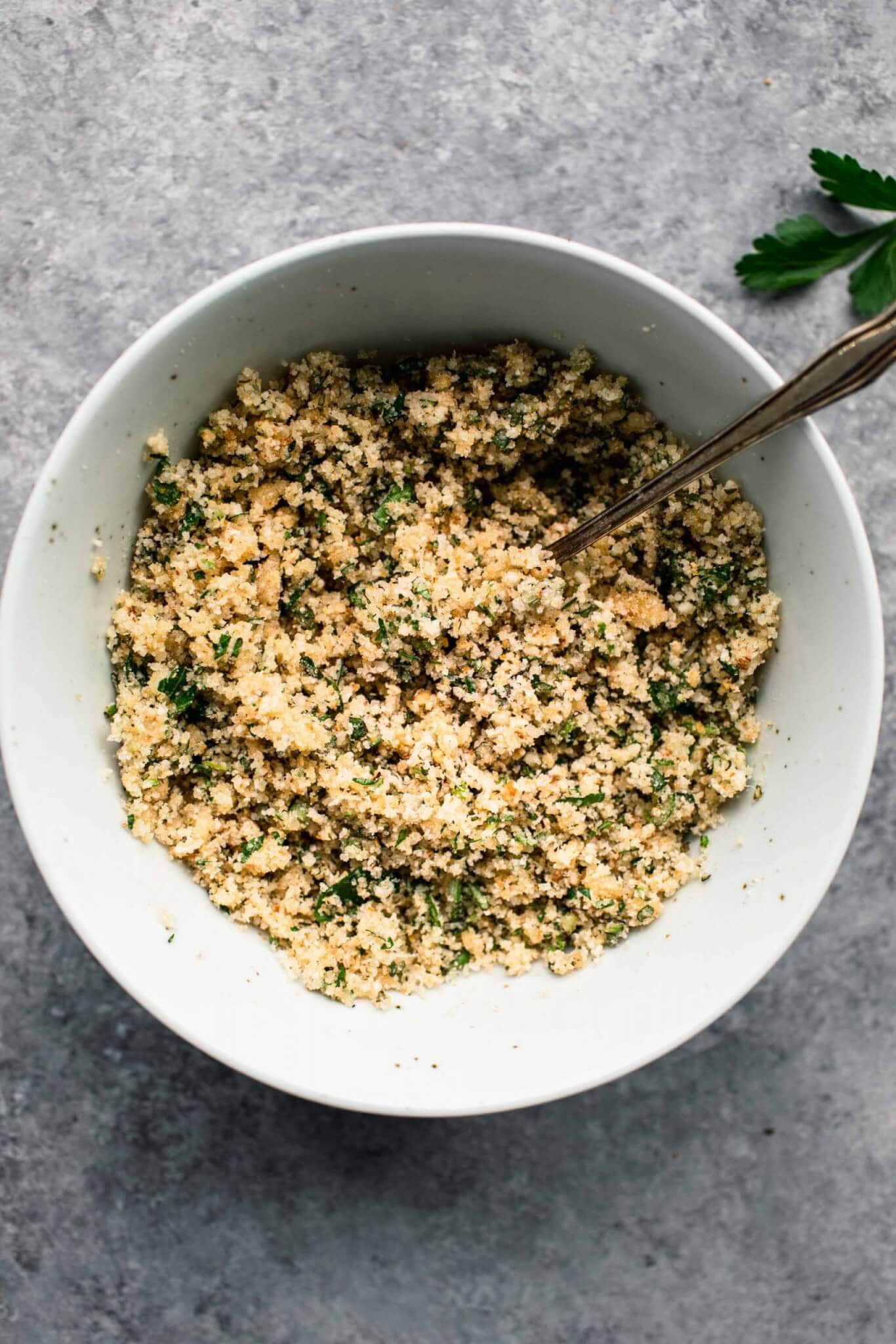 Breadcrumb mixture in small white bowl.