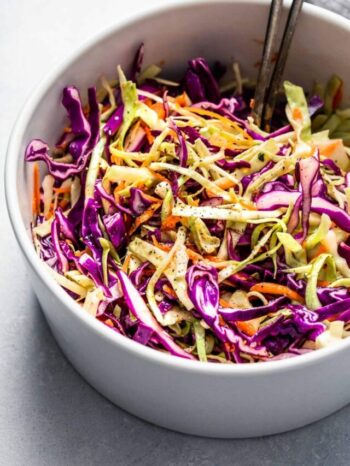Side view of vinegar slaw in mixing bowl.