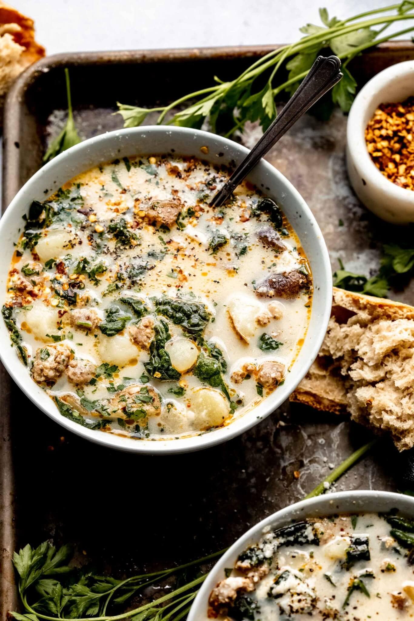 Side view of bowl of zuppa toscana.