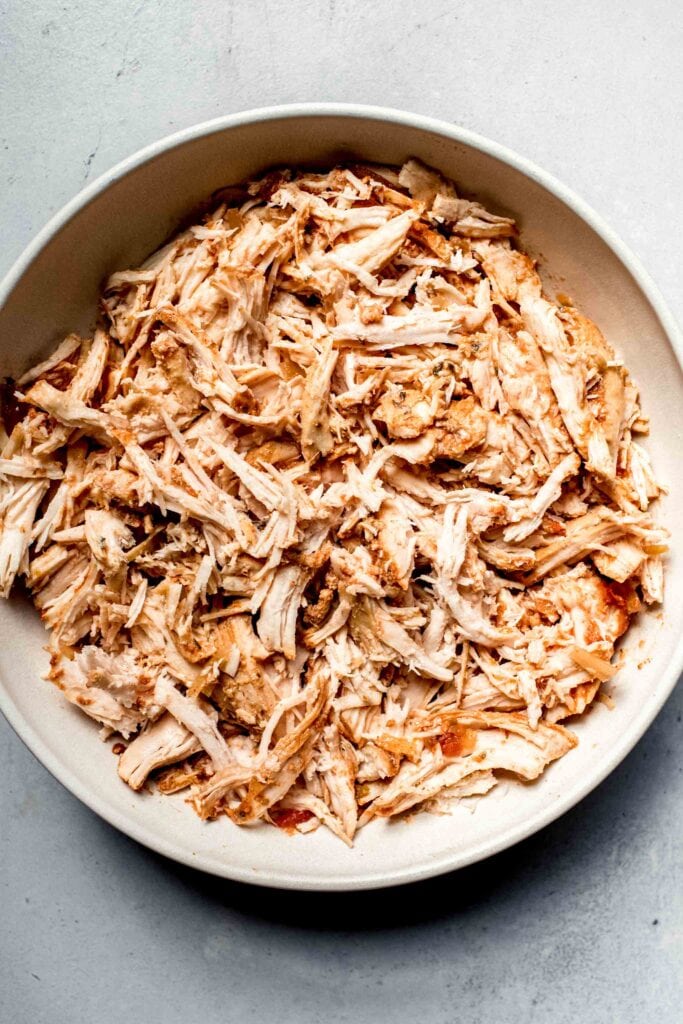 Shredded chicken in bowl. 